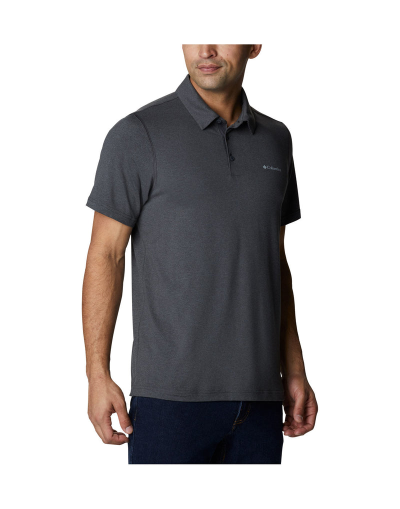 Right side front view a man wearing Columbia Men's Tech Trail™ Polo Shirt in shark heather colour.