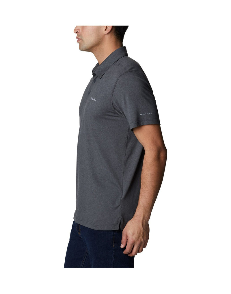 Left side view of a man wearing Columbia Men's Tech Trail™ Polo Shirt in shark heather colour.