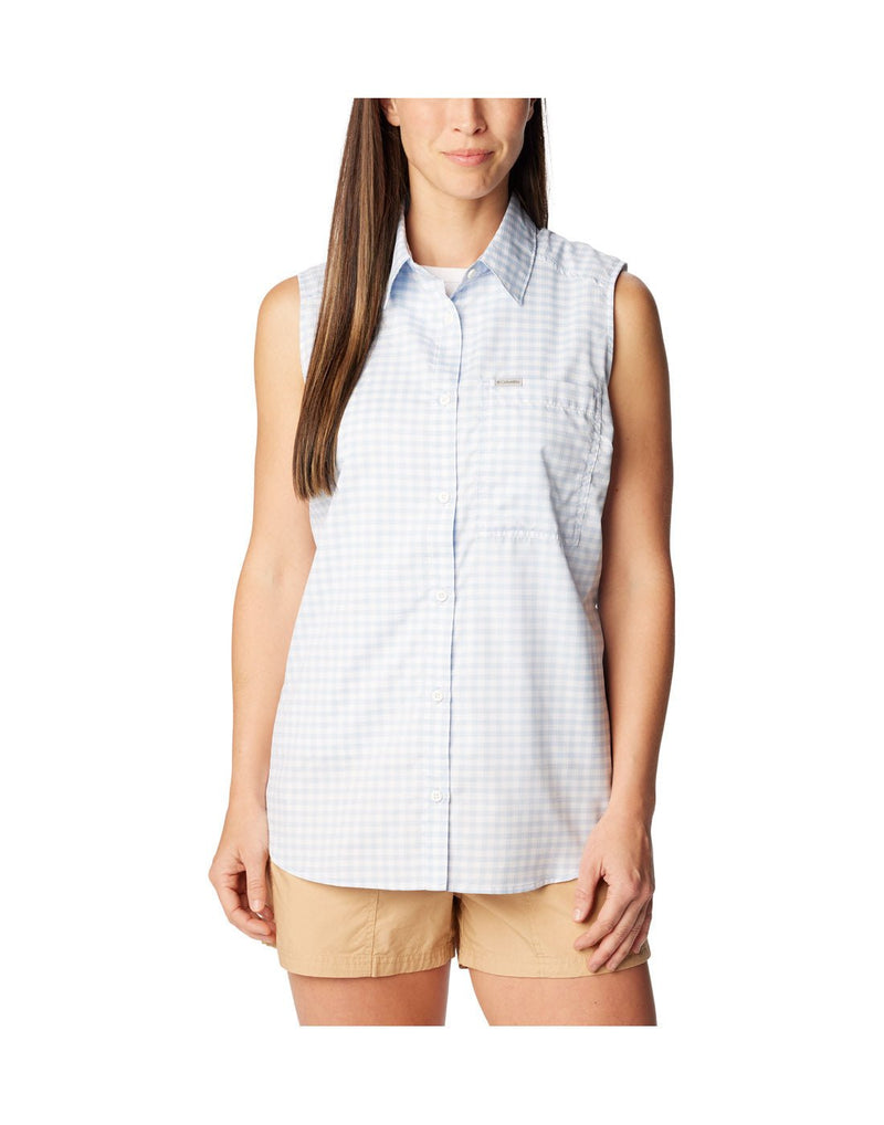 Woman wearing beige shorts and Columbia Women's Anytime™ Lite Sleeveless Top in whisper light blue and white checkered pattern, front view