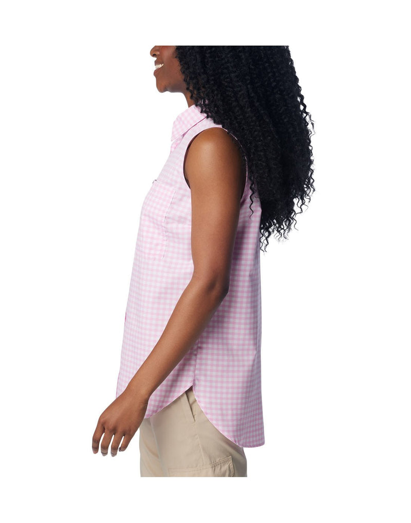 Woman wearing beige pants and Columbia Women's Anytime™ Lite Sleeveless Top in cosmos light pink and white checkered pattern, side view