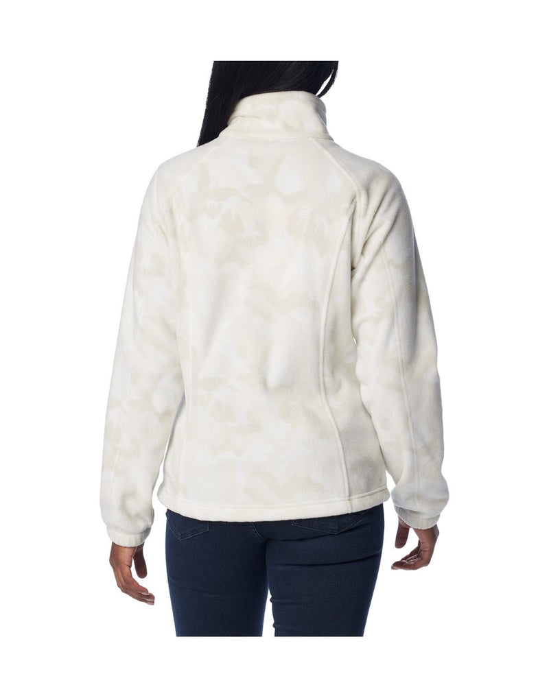 Woman wearing dark blue jeans and Columbia Women's Benton Springs™ Printed Full Zip Fleece Jacket in dark stone peonies, white with light beige floral pattern, back view