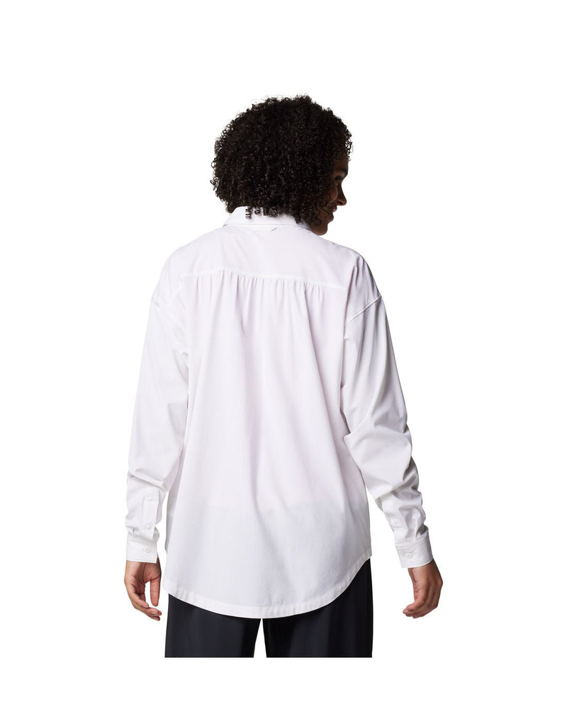 Woman wearing black pants and Columbia Women's Boundless Trek™ Layering Long Sleeve Shirt in white, back view