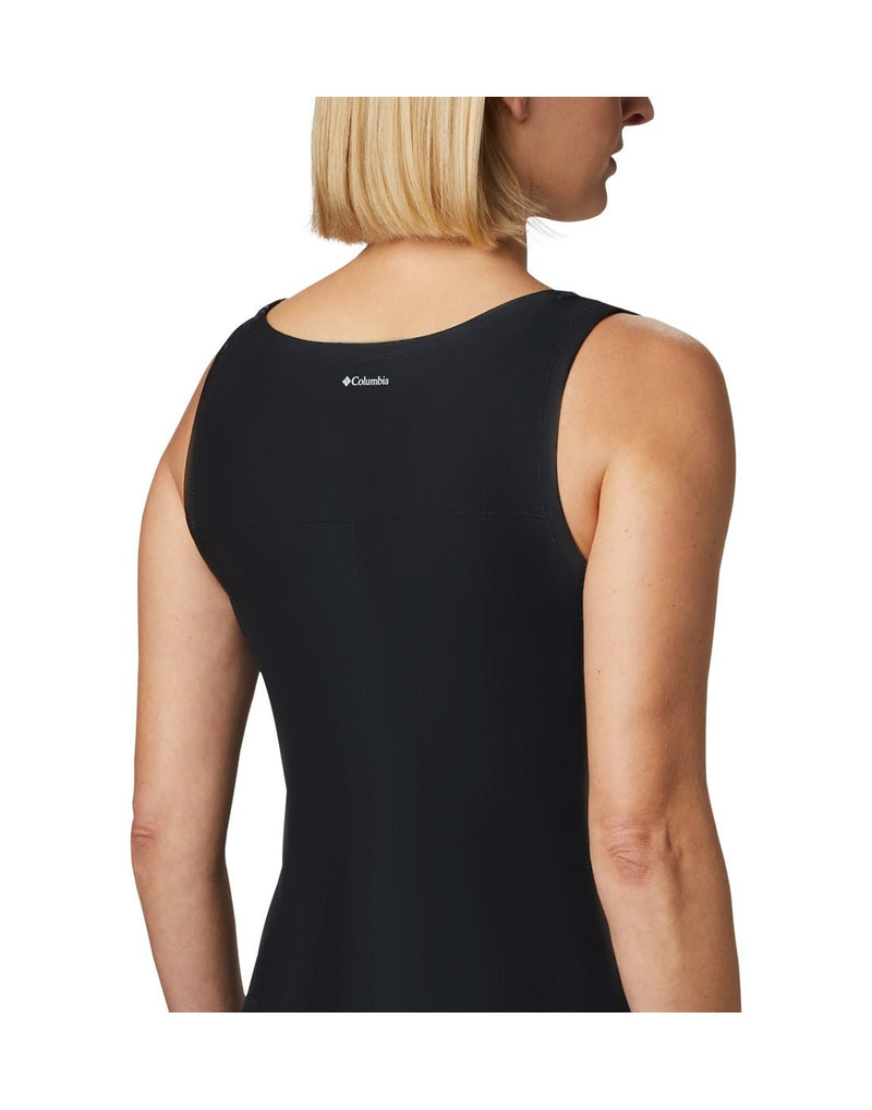Angled right side back view of a woman wearing Columbia Women's Chill River™ Printed Dress in black.