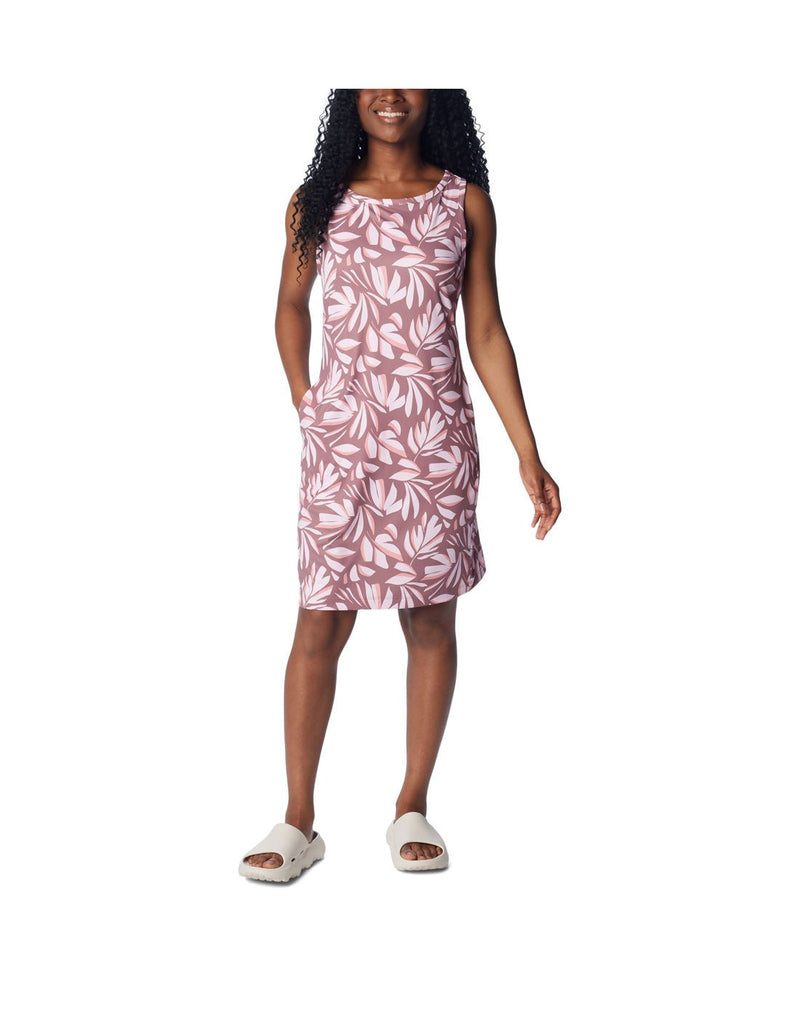 Front view of a woman wearing Columbia Women's Chill River™ Printed Dress in fig areca print. with hand in right side pocket