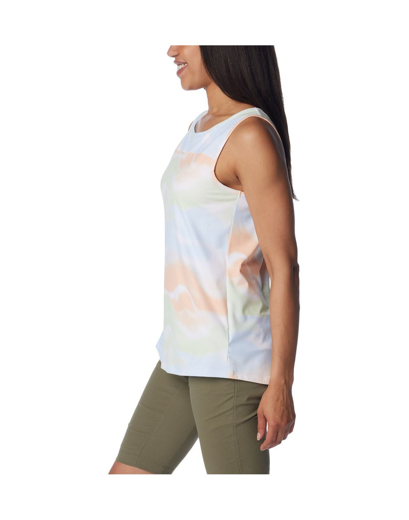 Left side view of a woman wearing Columbia Women's Chill River™ Tank in White Undercurrent print.