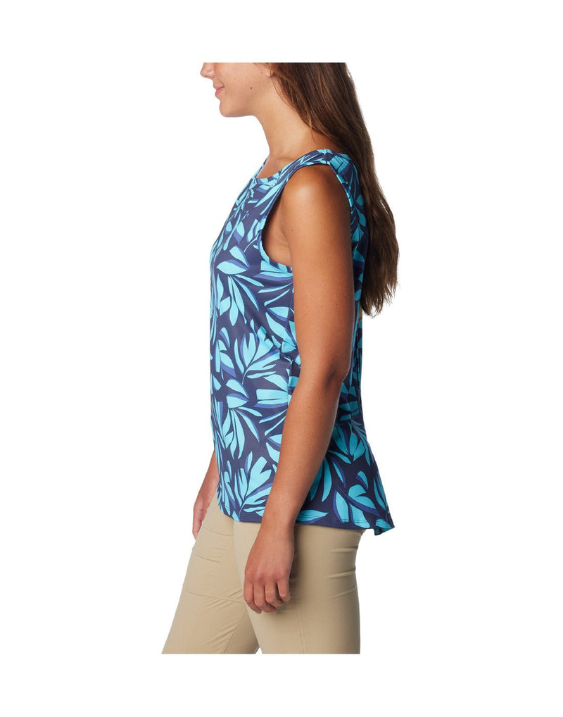 Left side view of a woman wearing Columbia Women's Chill River™ Tank in Aquamarine Areca print.