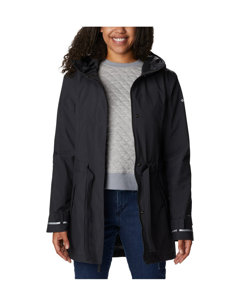 Woman wearing Columbia Women's Here and There™ II Rain Trench in black, unzipped, front view