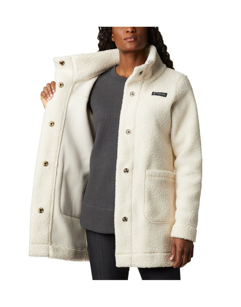 Woman wearing Columbia Women's Panorama™ Long Jacket in chalk colour, front view, holding one side open to show interior