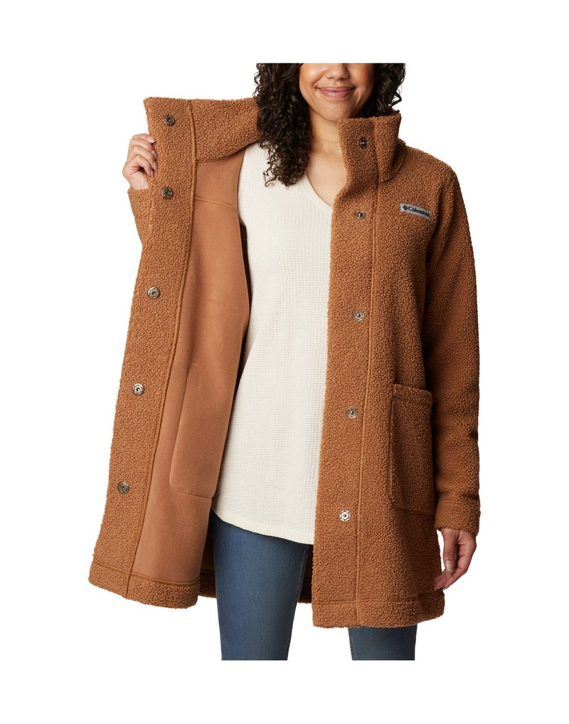 Woman wearing Columbia Women's Panorama™ Long Jacket in camel brown colour, front view, holding one side open to show interior