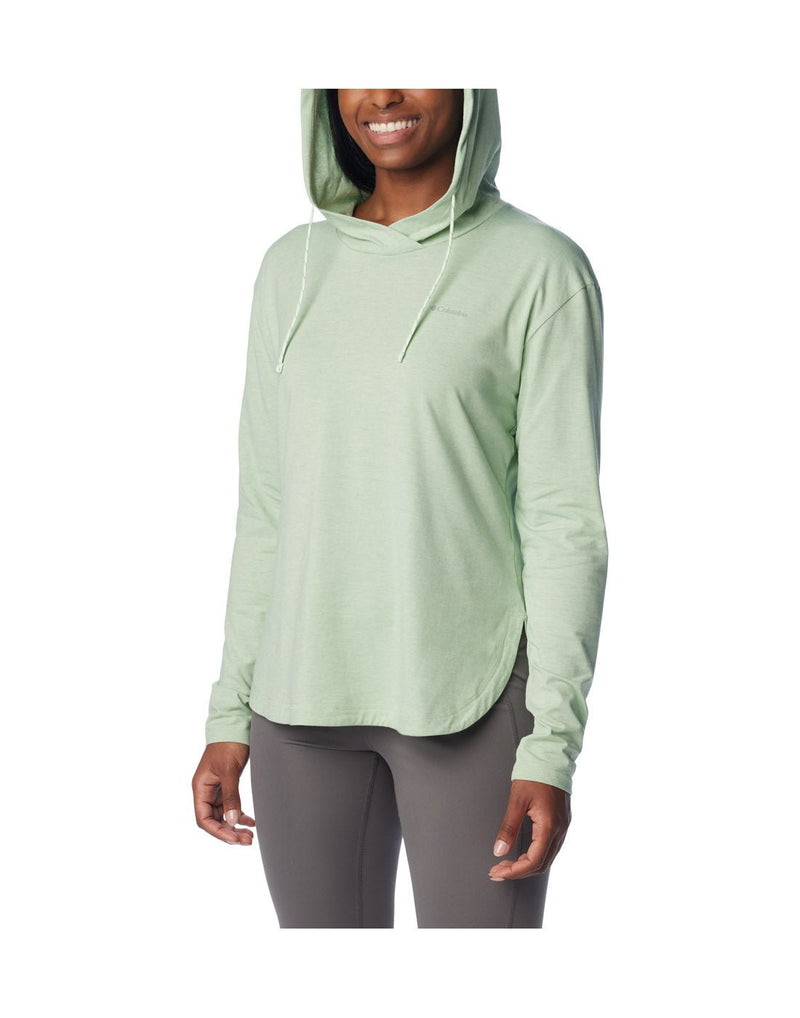 Front view of a woman wearing Columbia Women's Sun Trek™ Hooded Pullover in Sage Leaf Heather colour with hood up.