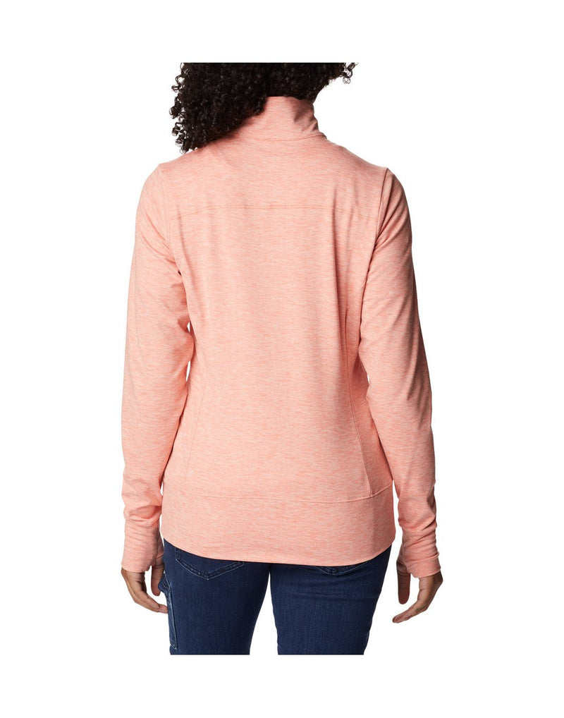 Woman wearing blue jeans and Columbia Women's Weekend Adventure™ Full Zip Jacket in peach heather, back view