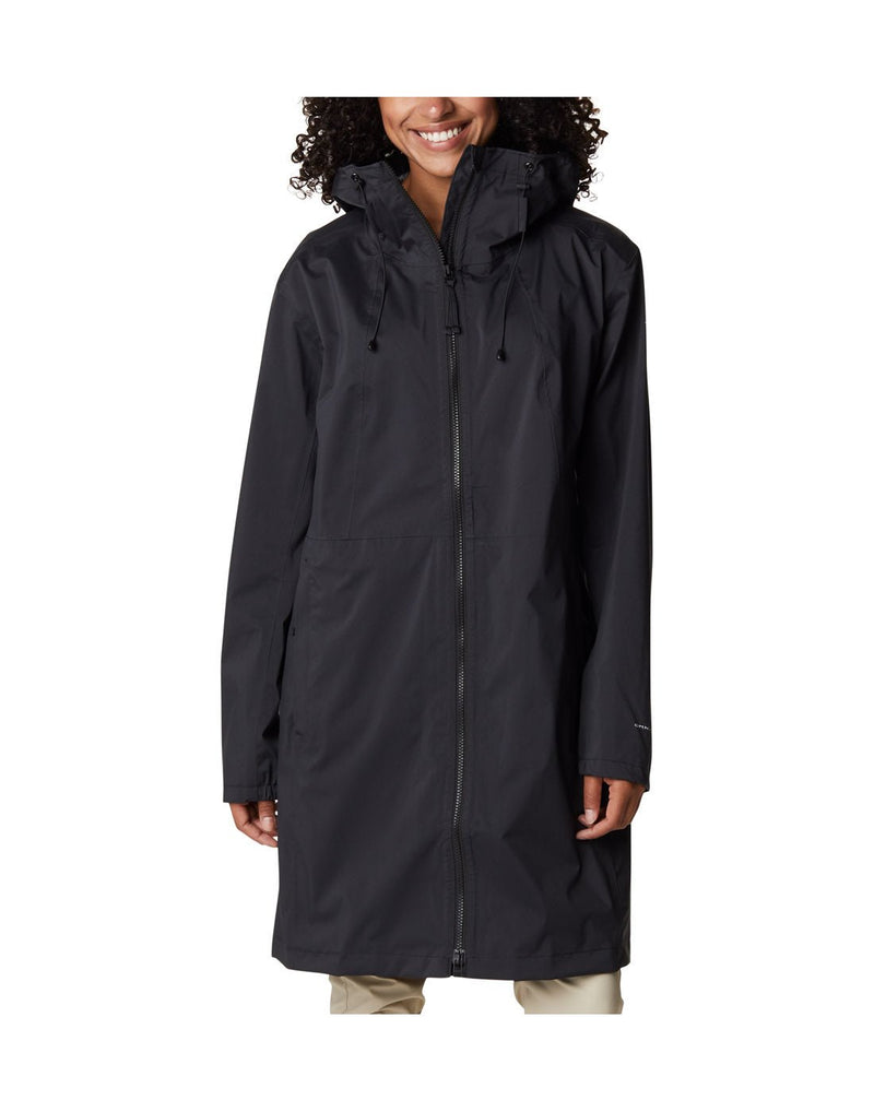 Woman wearing Columbia Women's Weekend Adventure™ Long Shell Jacket in black, zipped up, front view, jacket reaches knee length