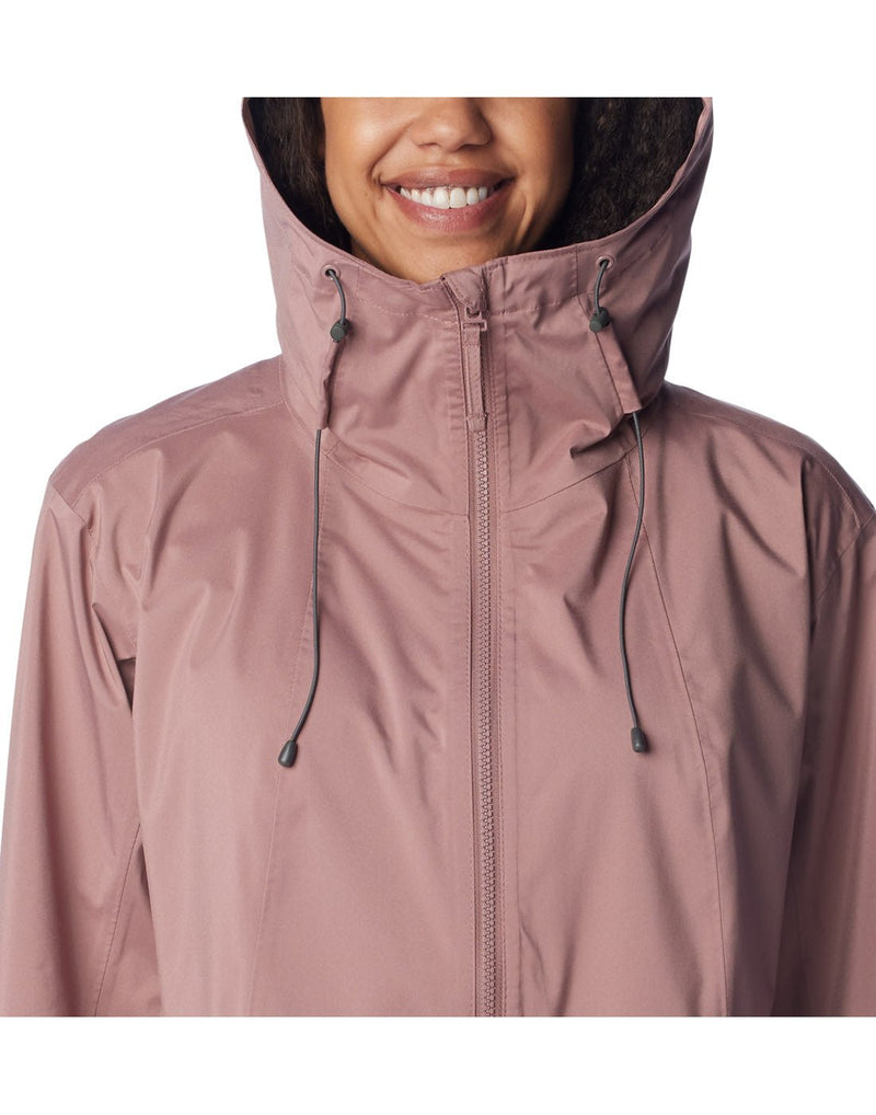 Close up of woman wearing Columbia Women's Weekend Adventure™ Long Shell Jacket in fig, hood up, front view