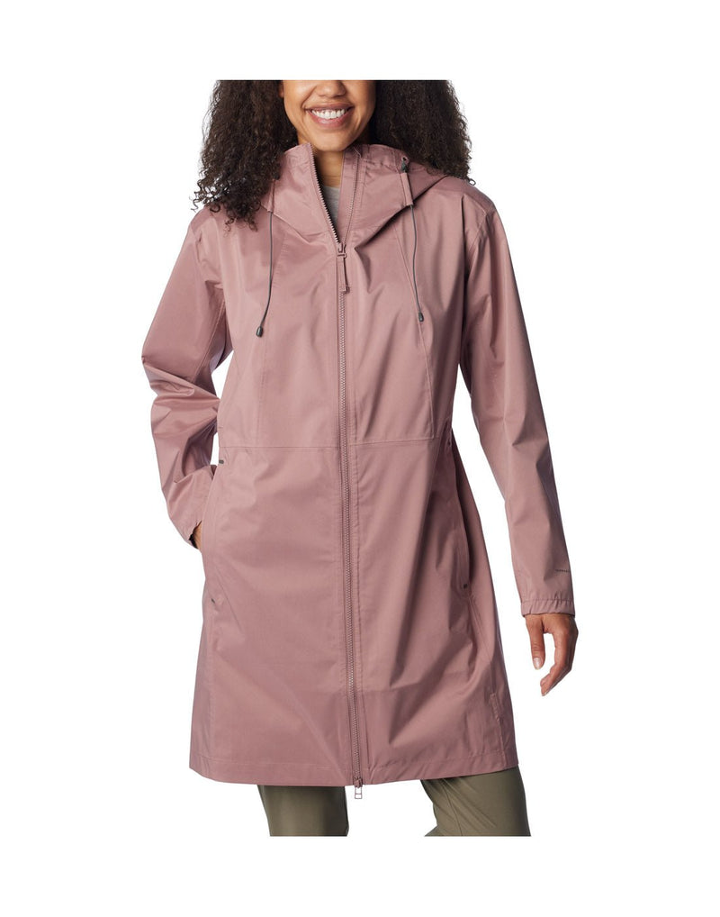 Woman wearing Columbia Women's Weekend Adventure™ Long Shell Jacket in fig, zipped up, front view, jacket reaches knee length