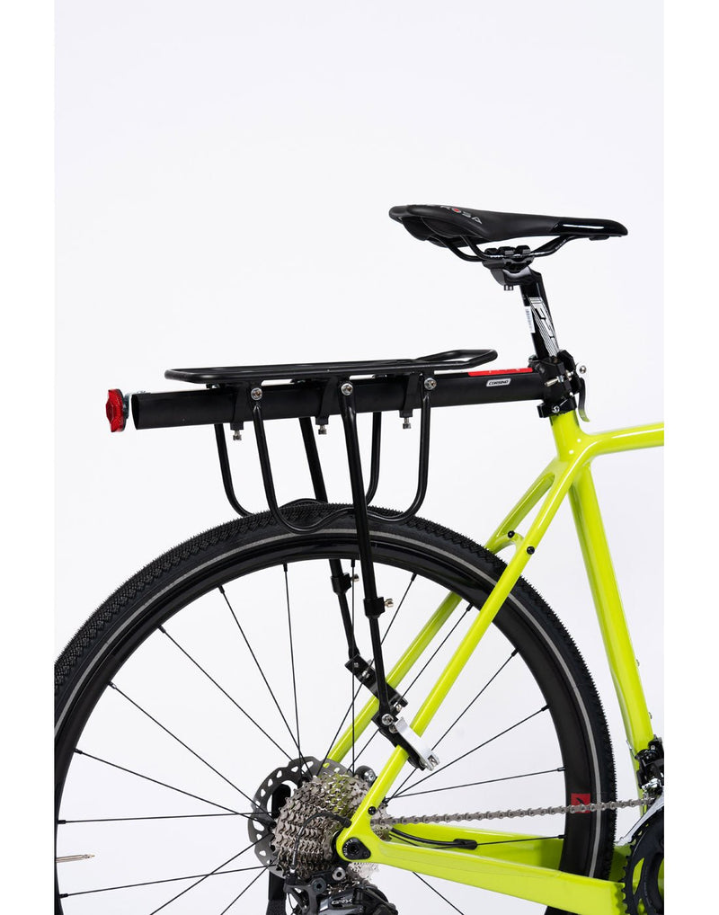 Corsino Tack Panier Rack - black, attached to back of a bicycle, side view