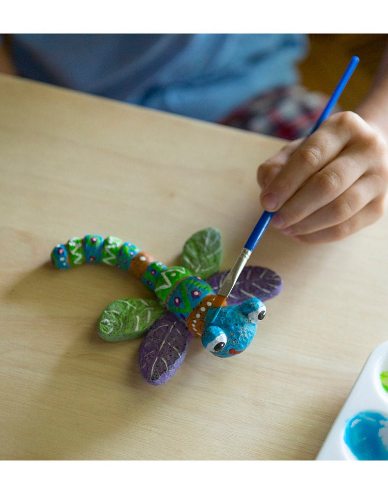Child painting a dragonfly Color Pops® Paint-Your-Own Rock Pet