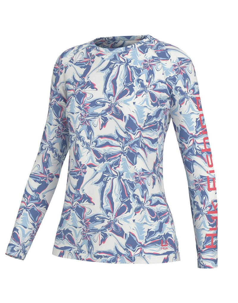 Huk Women's Brackish Flow Pursuit Long Sleeve, front view in crystal blue with white, blue, light blue and pink swirl pattern and Huk Fishing written in pink down length of left sleeve