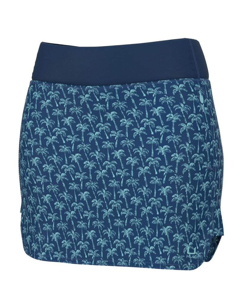 Huk Women's Cedros Skort in set sail blue with small turquoise palm tree pattern and solid blue waistband, front view