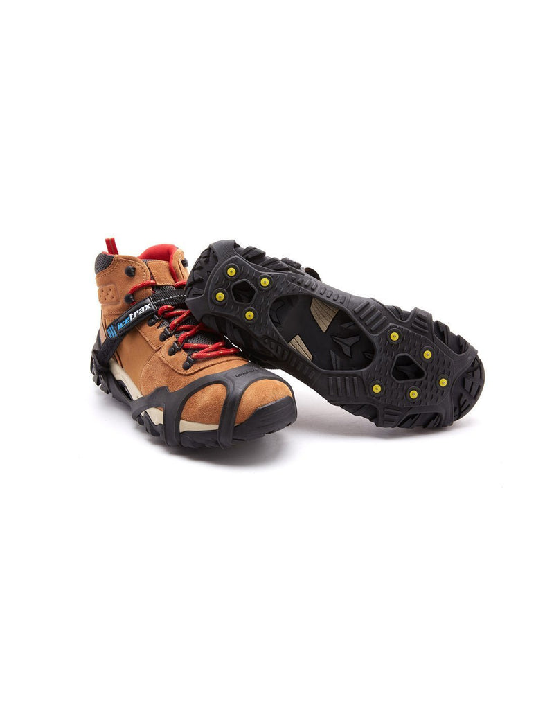 Icetrax V3 tungsten ice cleats with velcro straps on brown shoes