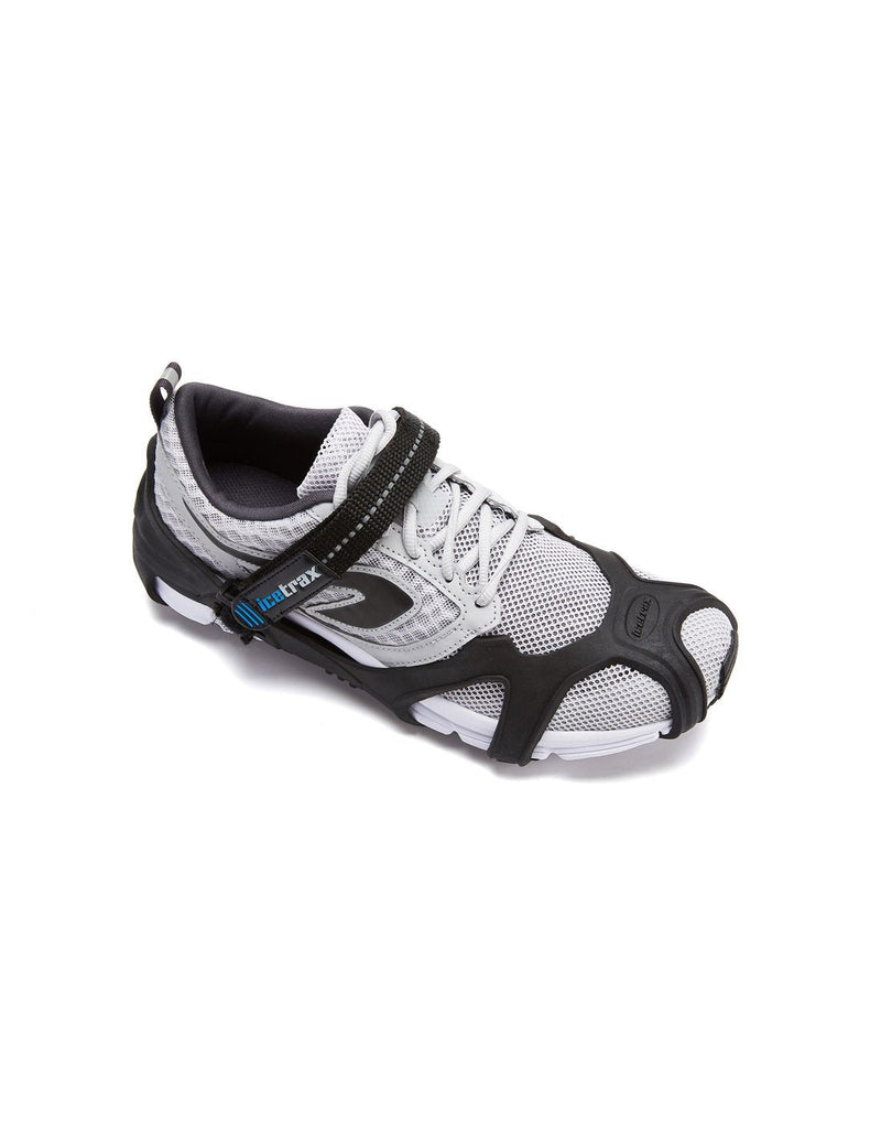 Icetrax V3 tungsten ice cleats with velcro straps on white shoes top view
