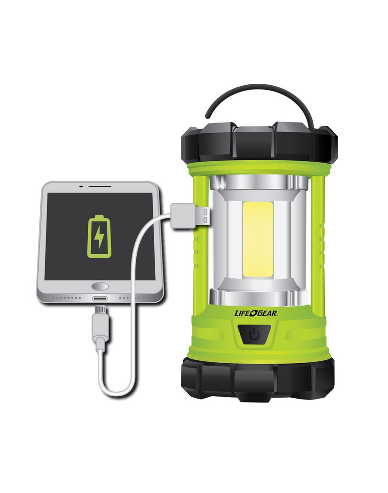 Life Gear USB Rechargeable Lantern and Power Bank front view showing phone plugging into USB port