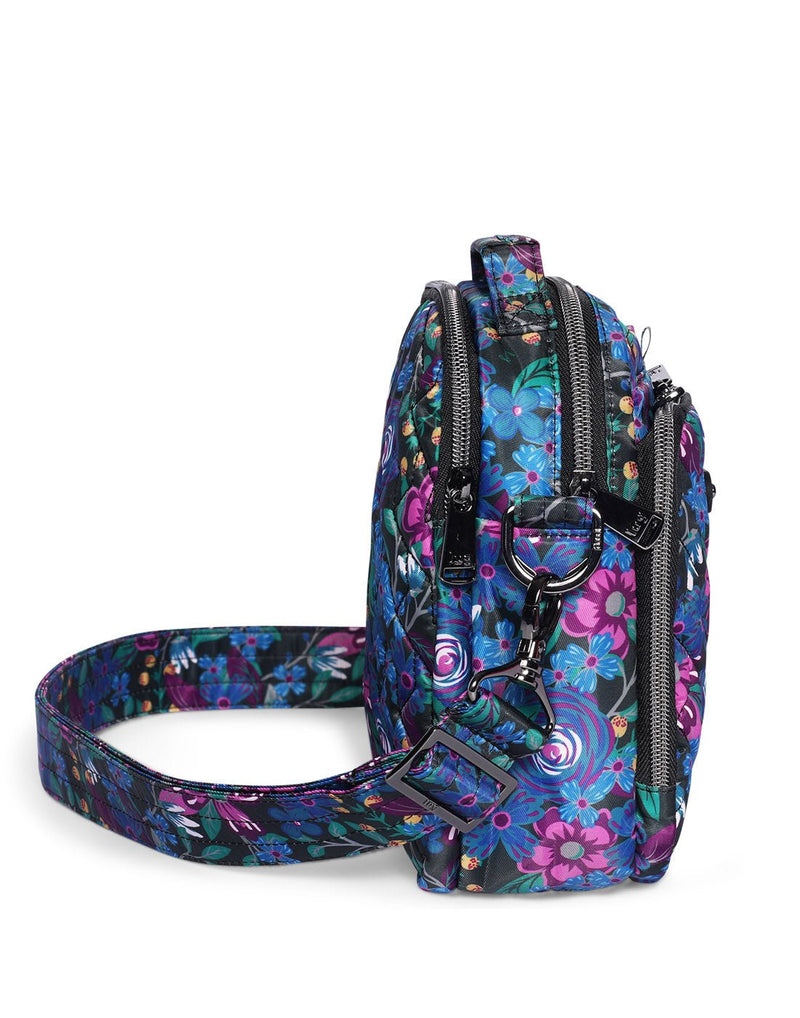 Lug Skeeter Convertible Crossbody, whimsy black with blue and purple flowers and green leaves, side view