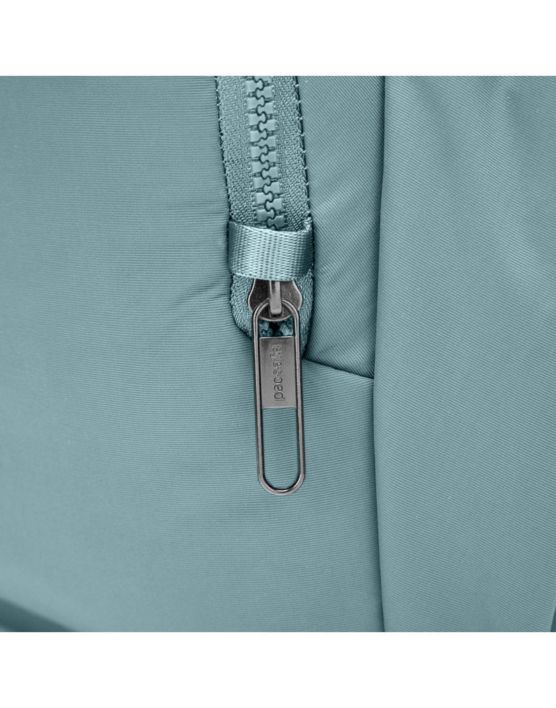 Close up of zipper pull in safety loop on side of bag