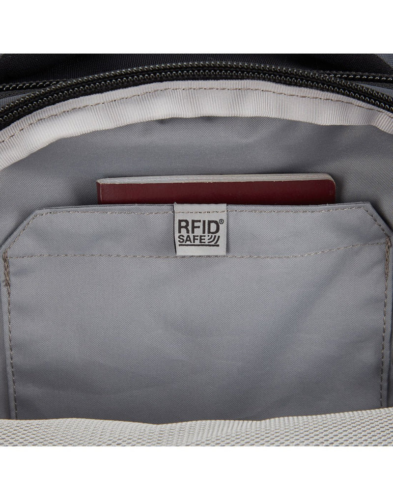 Close up of internal RFID slip pocket with passport inside