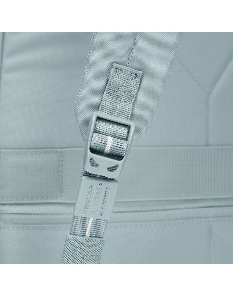 Close up of fresh mint adjustment clip on backpack strap