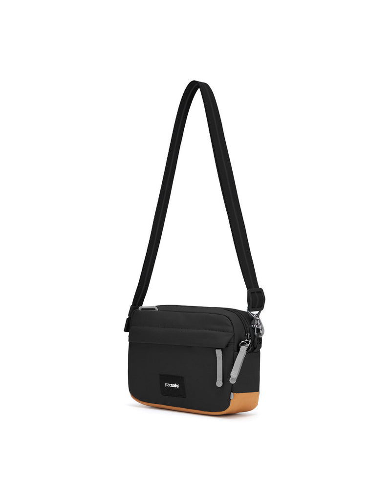 Pacsafe® GO Anti-Theft Crossbody Bag in jet black colour side view with Carrysafe® slashguard strap extended.