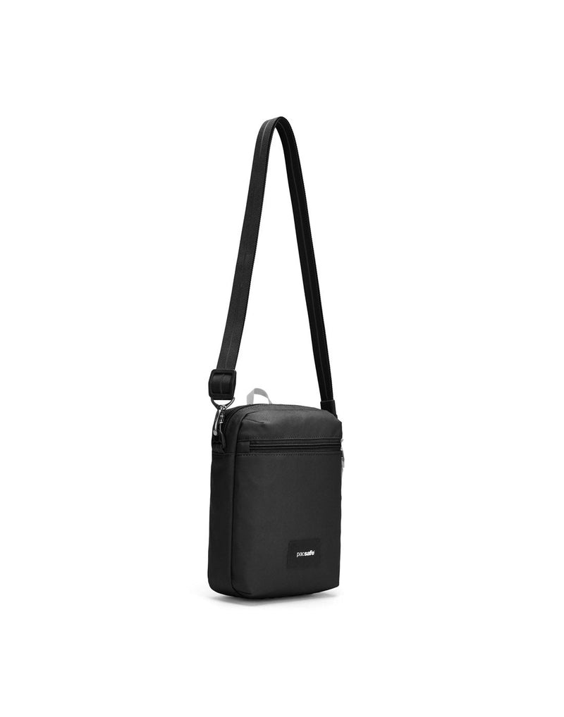 Pacsafe® GO Anti-Theft Festival Crossbody in jet black colour front left side view with cut-resistant strap extended.