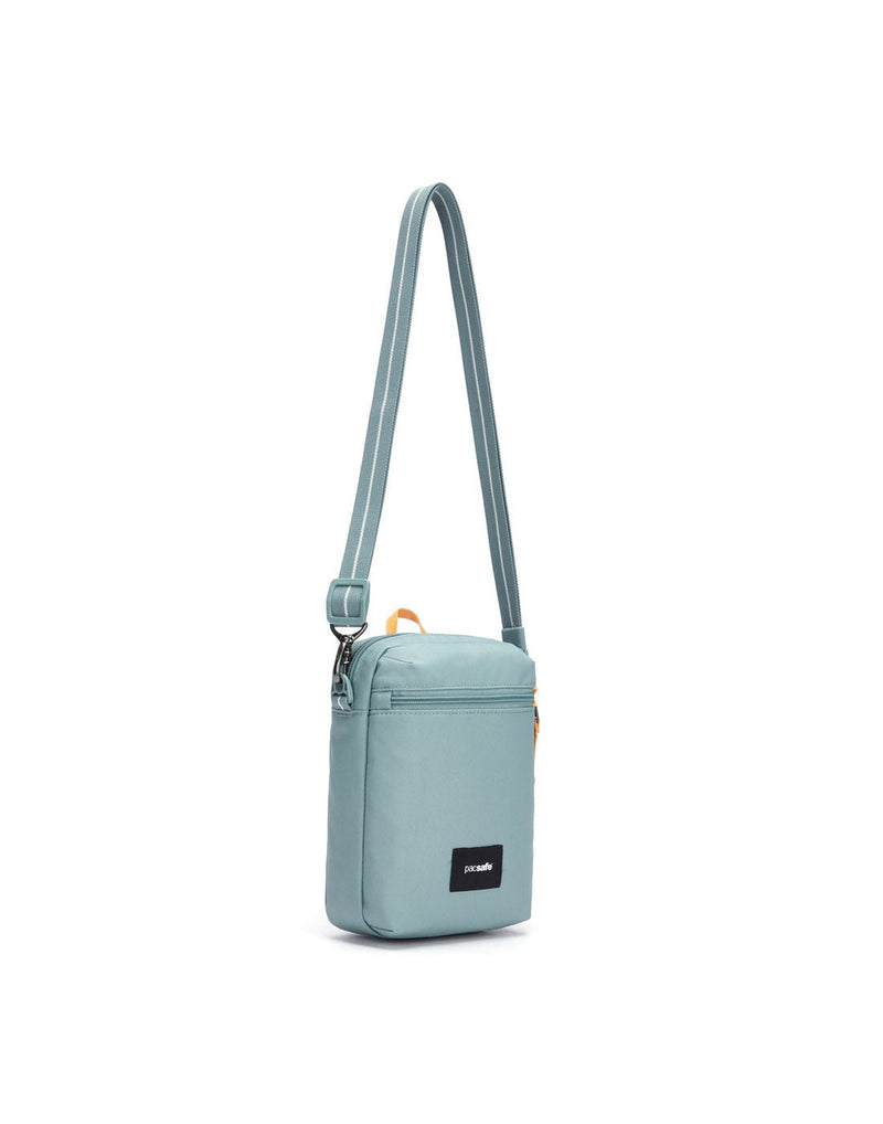 Pacsafe® GO Anti-Theft Festival Crossbody in fresh mint colour front left side view with cut-resistant strap extended.