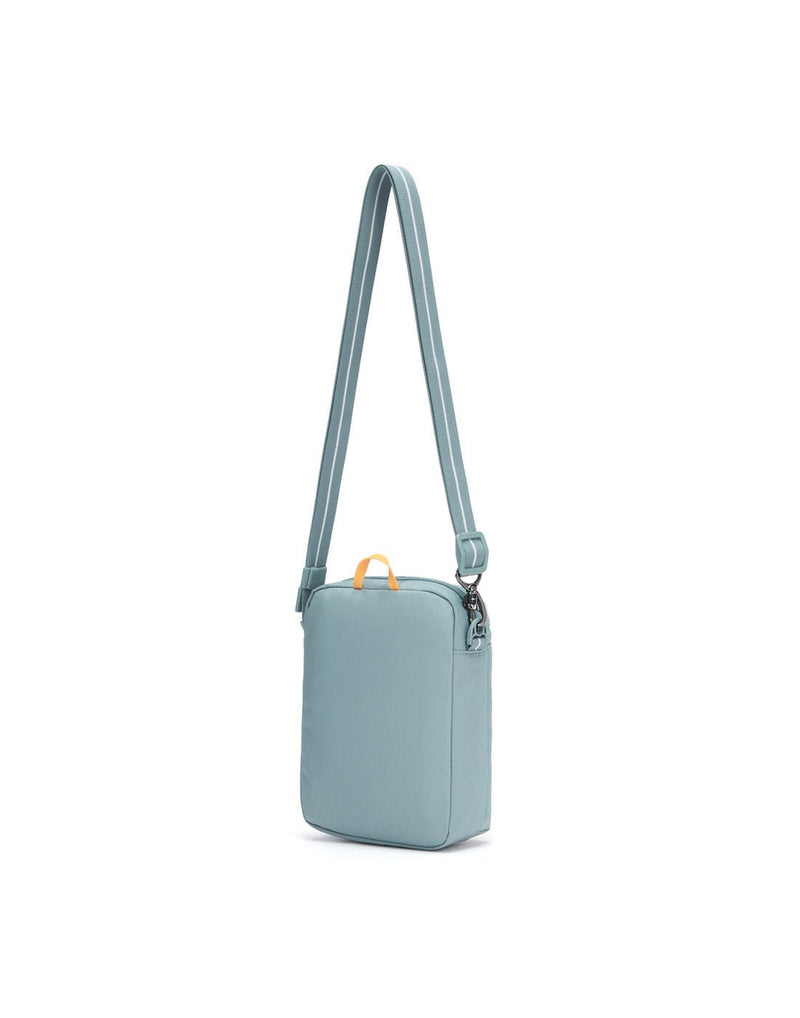 Pacsafe® GO Anti-Theft Festival Crossbody in fresh mint colour back view with cut-resistant strap extended.