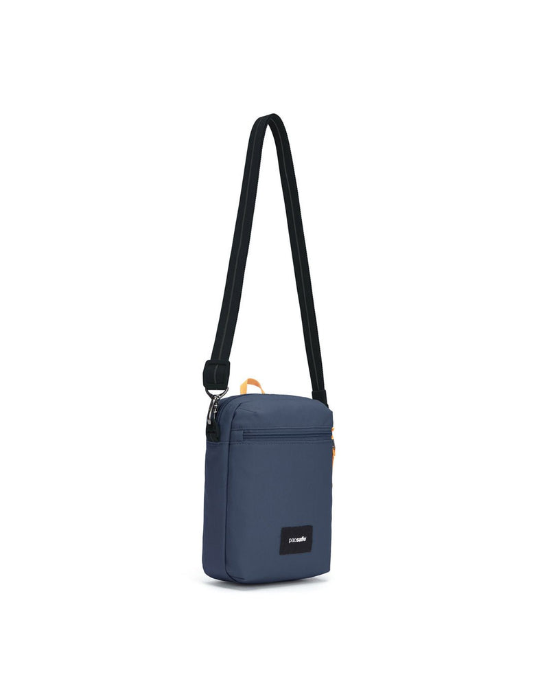 Pacsafe® GO Anti-Theft Festival Crossbody in coastal blue colour, front left side view with cut-resistant shoulder strap fully extended.
