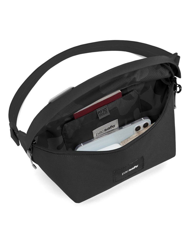 Pacsafe® GO Anti-Theft Sling Pack in jet black colour interior view showing a RFID blocking pocket.