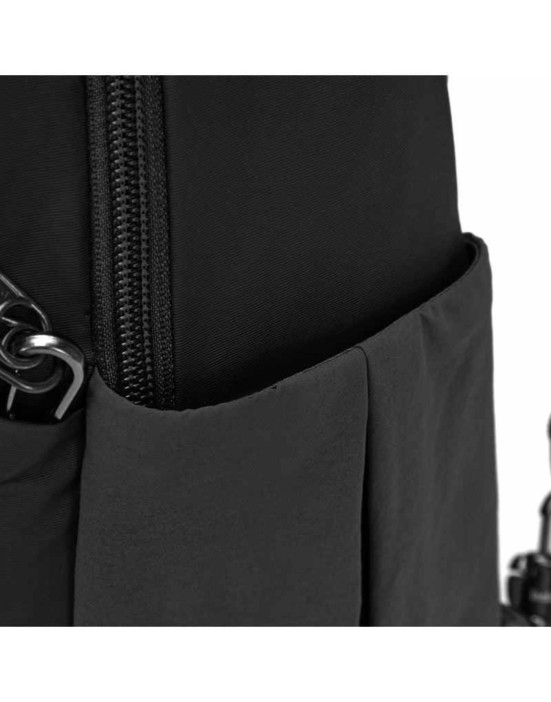 Close up of side slip pocket on black backpack