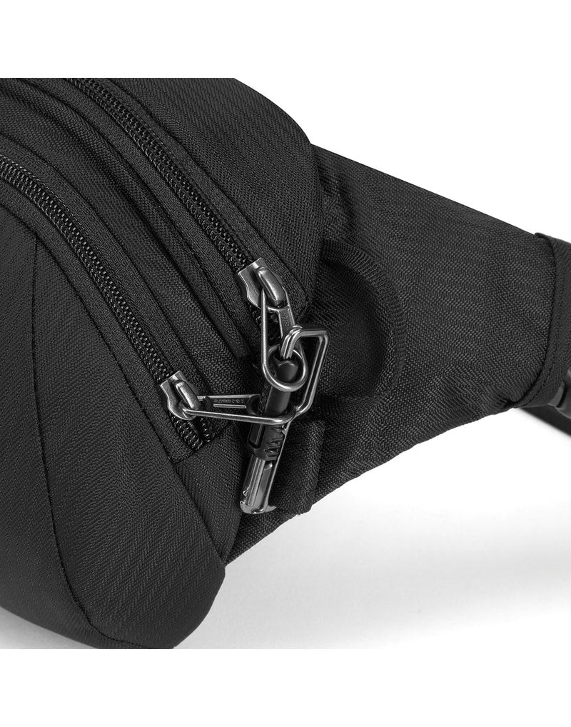 Close up of zipper pulls secured with safety latch on the black hip pack