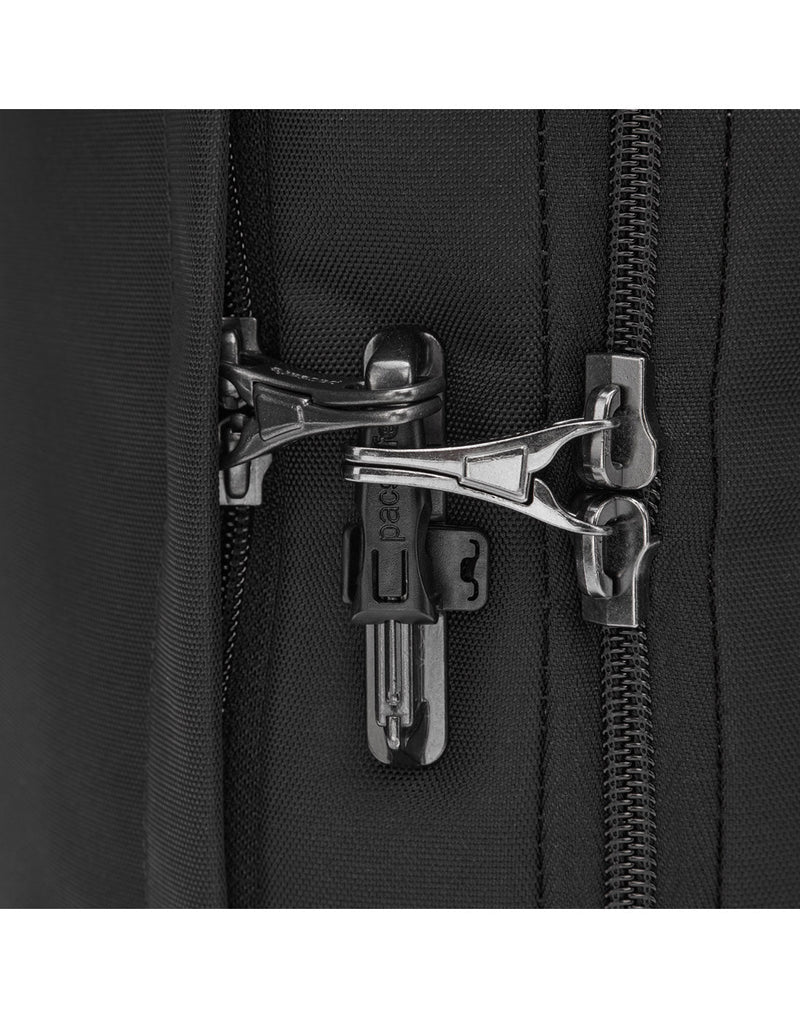 Close up of zipper pulls secured to safety latch