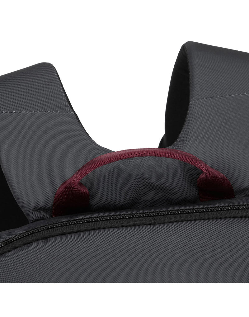 Close up of burgundy top grab handle on slate backpack