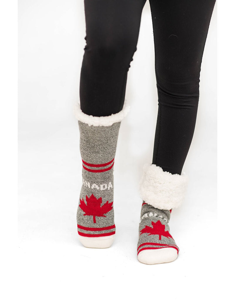 Front of a person wearing the Pudus Canada Slipper Socks with one rolled down to show sherpa lining