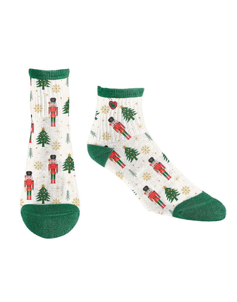 Pudus white socks with green cuff, heel and toe with red nutcrackers and green Christmas trees
