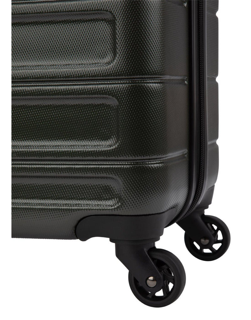 Close up of spinner wheels on forest green luggage