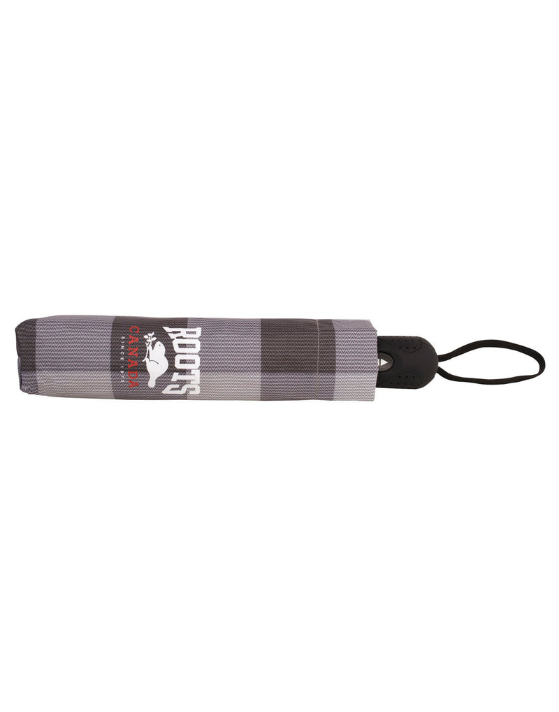 Roots Canada Plaid Umbrella in black/white plaid pattern, closed in self-fabric pouch with white Roots logo on side