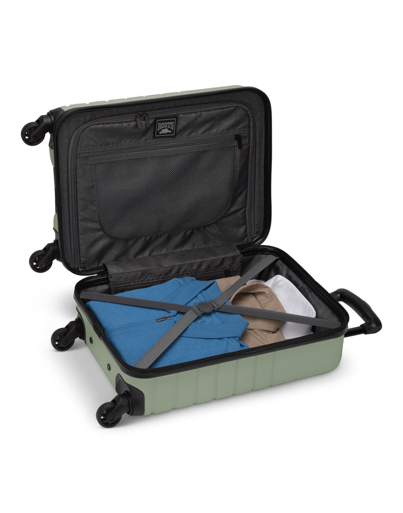 Roots Panorama 19" Hardside Spinner Carry-on in seagrass, pale green colour, open view with clothes packed inside