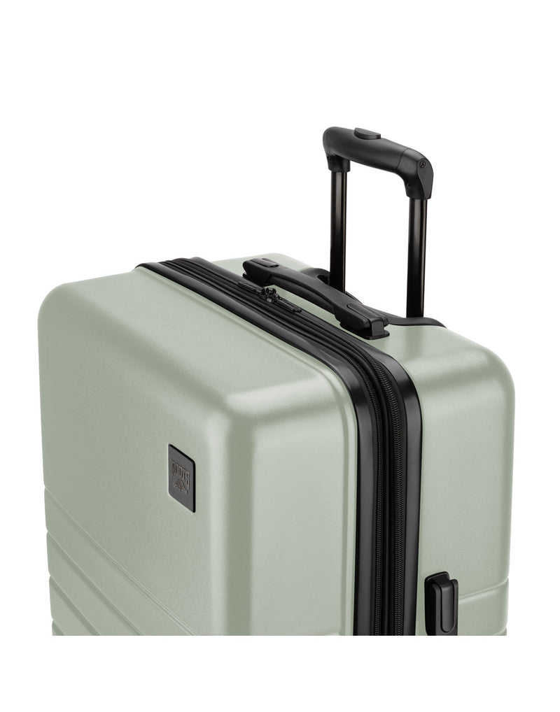 Roots Panorama 24" Hardside Expandable Spinner in seagrass, pale green colour, top front view with black telescopic handle extended
