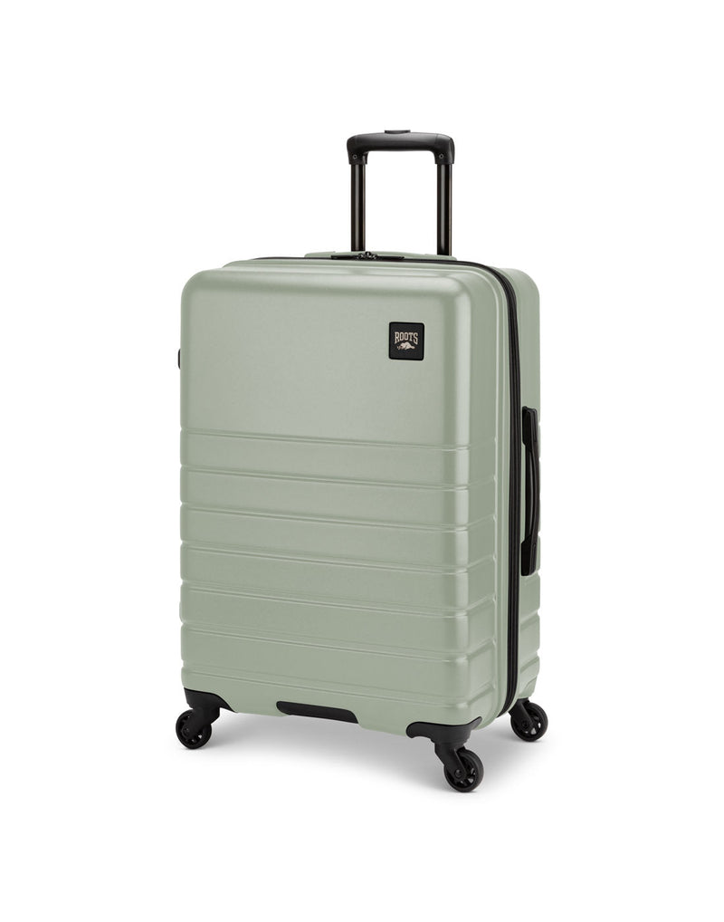 Roots Panorama 24" Hardside Expandable Spinner in seagrass, pale green colour, front angled view