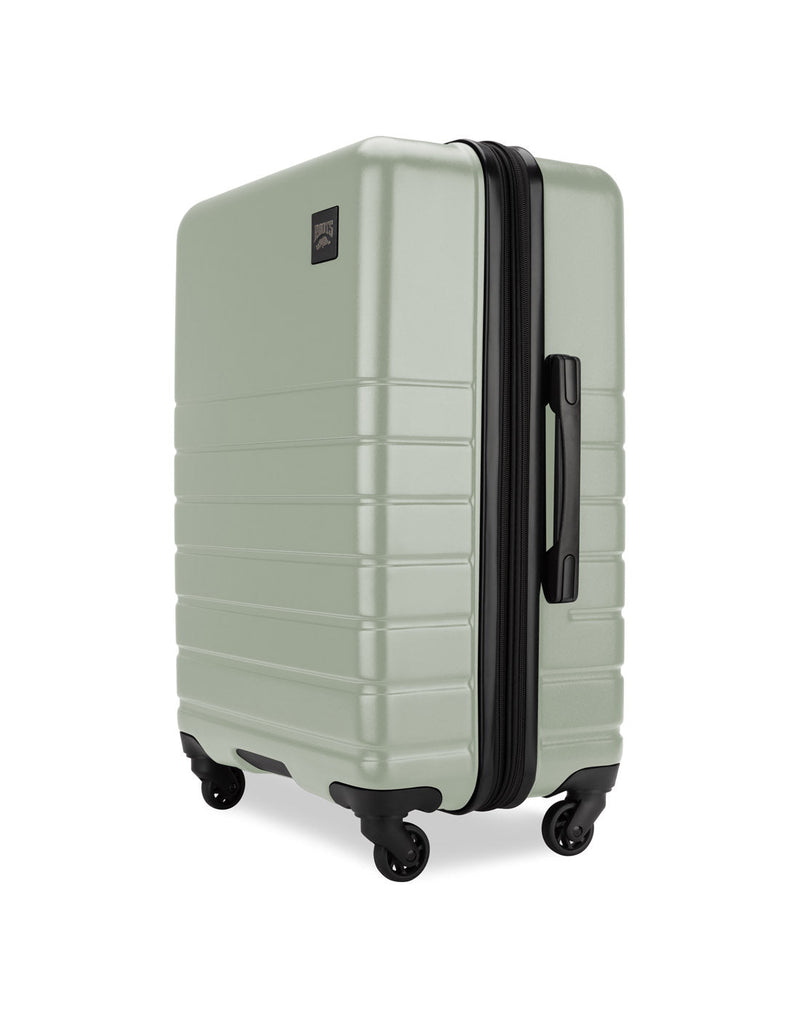 Roots Panorama 24" Hardside Expandable Spinner in seagrass, pale green colour, side angled view of black side grab handle