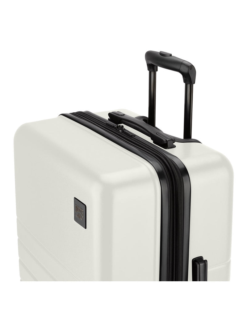 Roots Panorama 28" Hardside Expandable Spinner in tofu, white colour, top front angled view with black telescopic handle extended