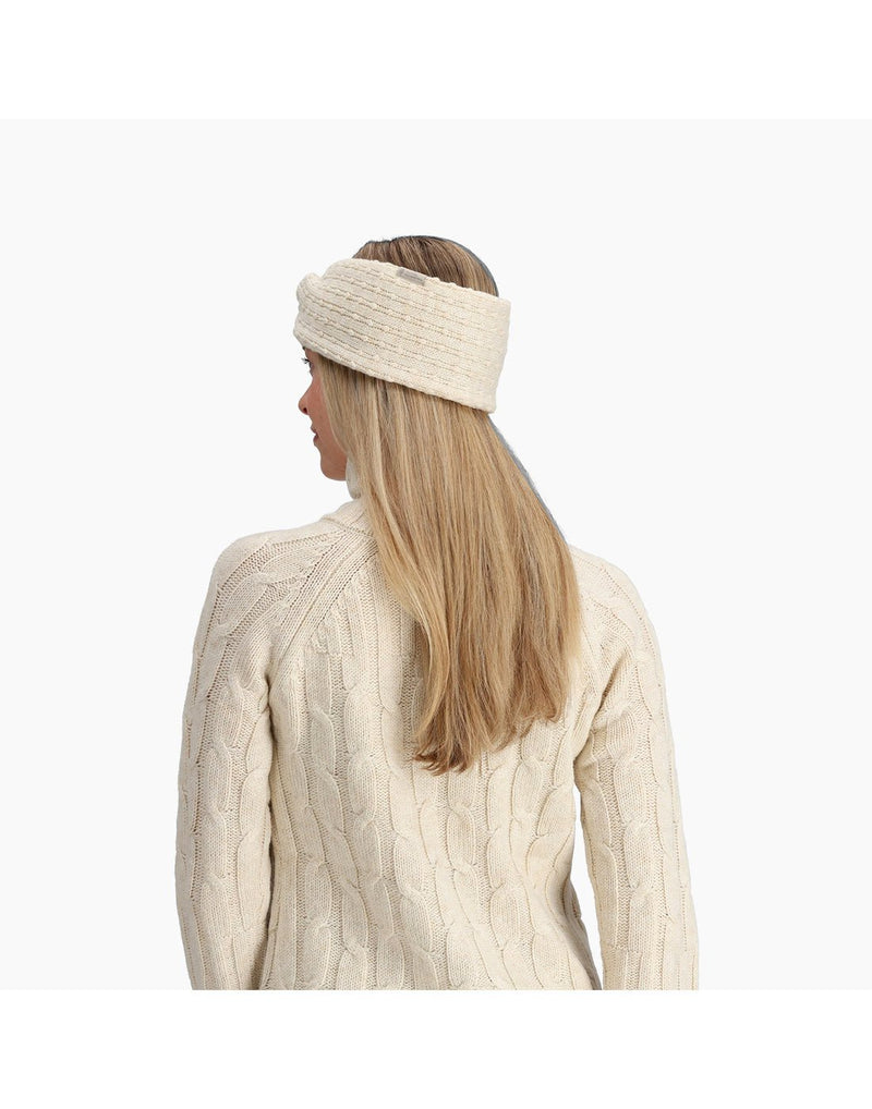 Back view of a woman wearing the Royal Robbins Baylands Reversible Headband in Ivory White.