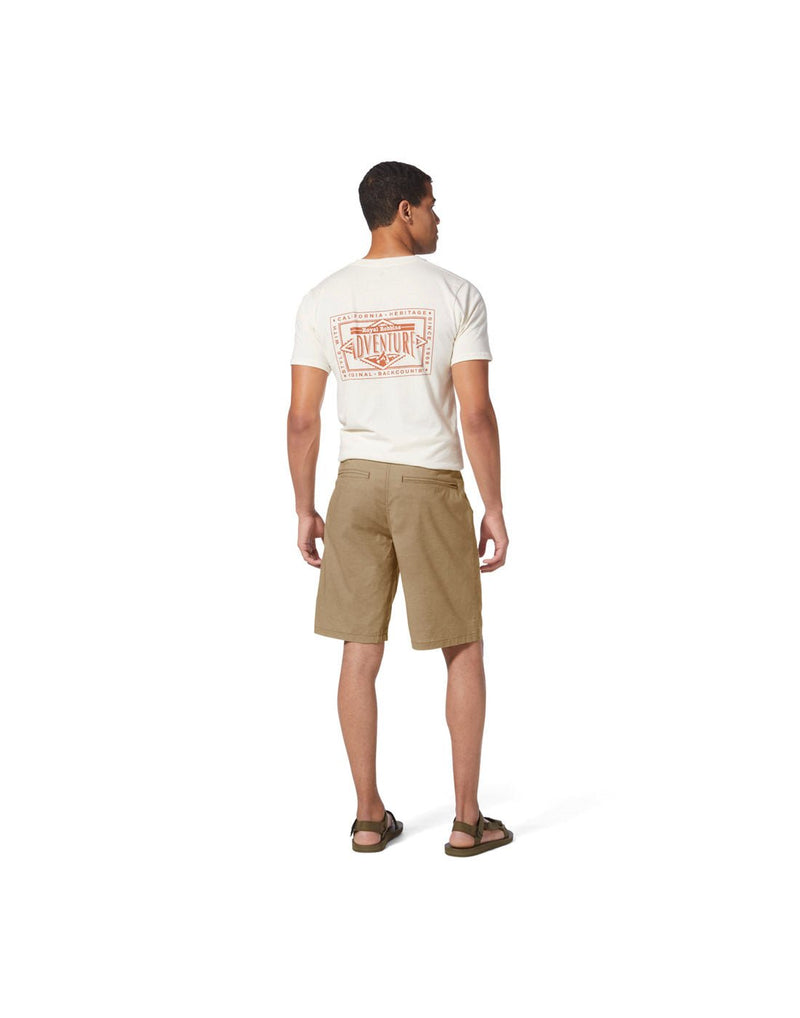 Man wearing white t-shirt, sandals and Royal Robbins Men's Hempline Short in true khaki, back view